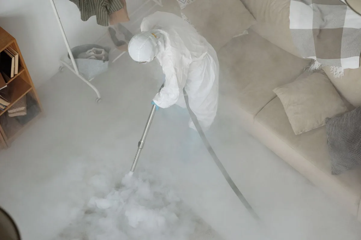 Biohazard cleanup technician in protective equipment, Rancho Viejo, TX